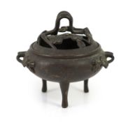 A Chinese bronze censer and cover, 19th century,with cast and pierced ‘prunus’ cover and handles, on