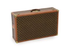 A Louis Vuitton brass mounted leather bound suitcase,number 77612,76 x 46cm depth 22cmOverall