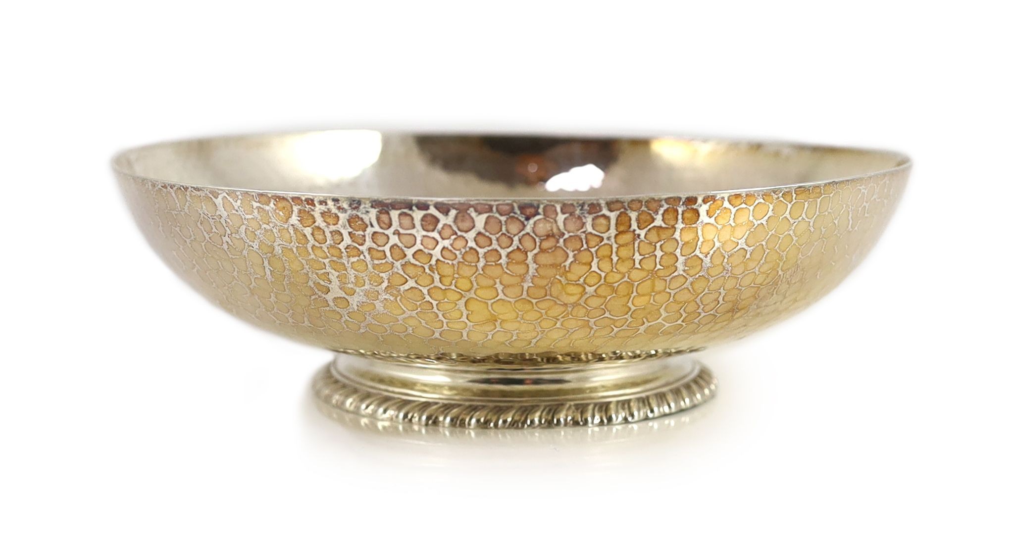 A George V hammered silver fruit bowl, by Mappin & Webb,engraved with the name 'Janet', on gadrooned