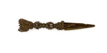 A Tibetan bronze Purba, 17th/18th century,the triangular section blade emerging from the mouth of