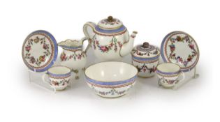 A Sevres porcelain part tea service, c.1772-3,each piece painted with flower festoons within puce