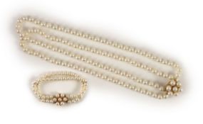 A modern continental double strand cultured pearl necklace with 14k gold and cultured pearl