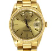 A gentleman's late 20th century 18ct gold Rolex Oyster Perpetual Day Date wrist watch, on an 18ct