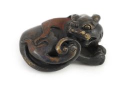 A Chinese bronze ‘lion dog’ scroll weight, Ming or later,6.4cm longOccasional minor dents and wear