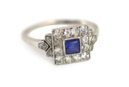 A 1920's/1930's platinum and millegrain set sapphire and diamond tablet cluster ring, with diamond