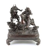 An impressive Japanese bronze group of an oni attacking a Samurai on horseback, Meiji period,