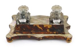 A Victorian tortoiseshell and mother of pearl inkstand,with a pair of glass inkwells and covers,