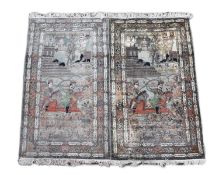 A pair of late 19th/ early 20th century Kashan silk pictorial rugs, woven with nobleman over hunters