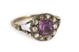 A Georgian gold, foil backed amethyst and rose cut diamond set cluster ring,size J/K, gross weight