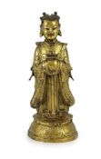 A Chinese Ming gilt bronze figure of an immortal, 16th/17th century,the figure standing and