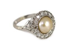 A mid 20th century platinum?, split pearl and diamond set circular cluster ring,size Q, gross weight