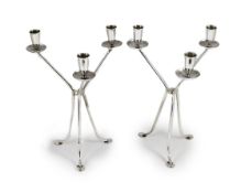 A modern pair of stylish three branch, three light candelabra by Harrods Ltd,on tripod supports,