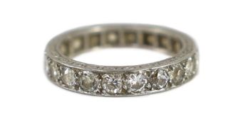 A platinum and diamond set full eternity ring,with carved shank, size O/P, gross weight 5.7 grams.