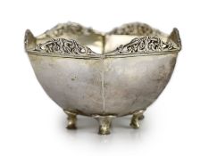 A George V planished silver hexagonal small bowl by Omar Ramsden,with pierced scroll border, on