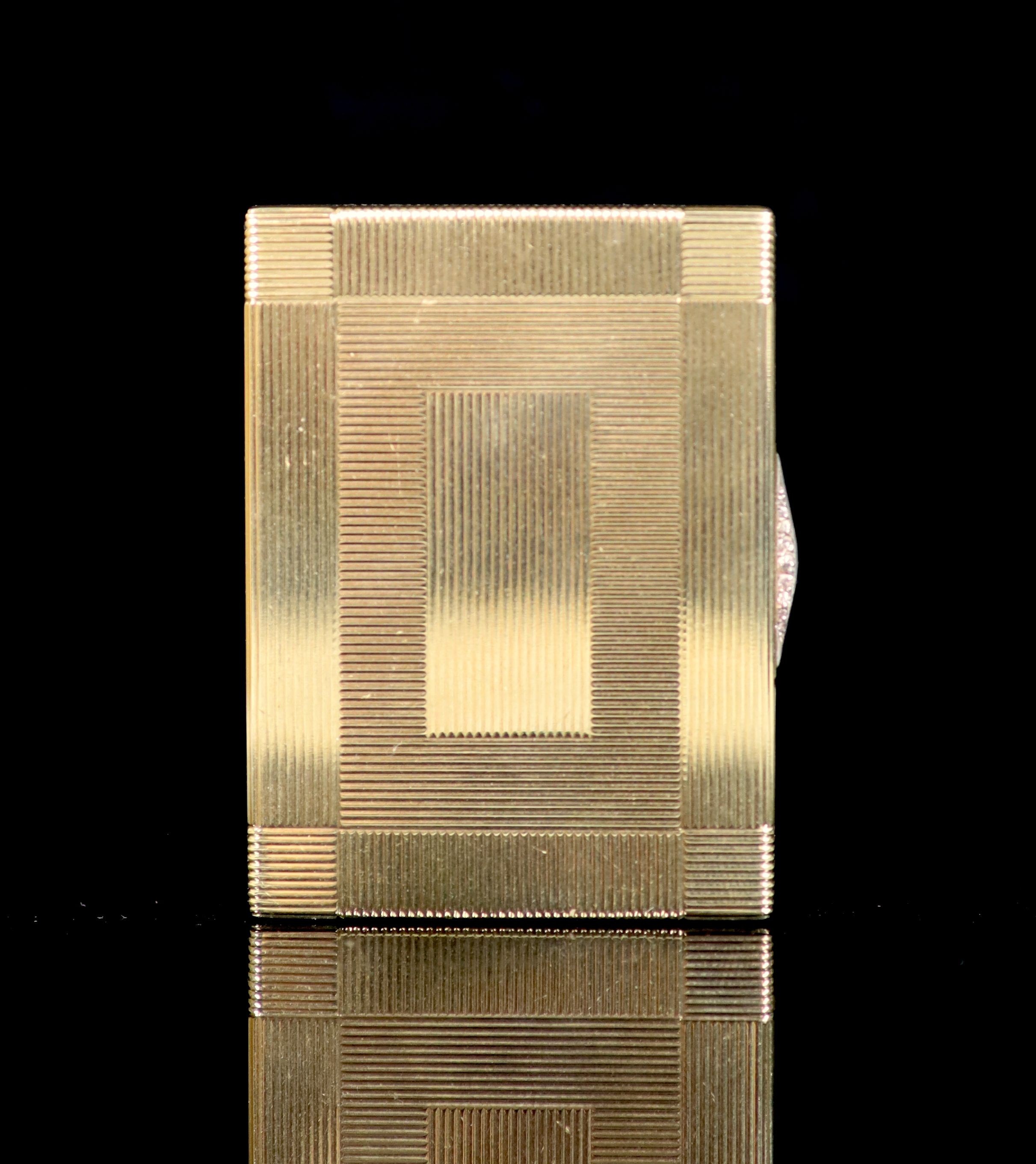 A 1930's Cartier 9ct gold compact, with diamond set thumbpiece,with reeded decoration and handled - Image 3 of 8