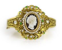 A Victorian gold, sardonyx cameo, split pearl, diamond and demantoid garnet set hinged bangle,with