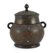 A Chinese Ming bronze jar and cover, hu,of oval section, cast in low relief with bands of stylised
