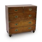 A Victorian brass mounted teak campaign chest,fitted two short and three long drawers, on turned
