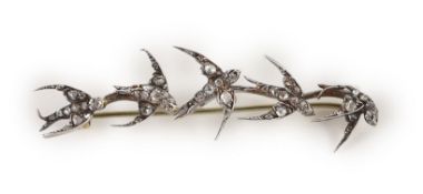 A late Victorian gold and rose cut diamond set brooch, modelled as five swallows in flight,59mm,