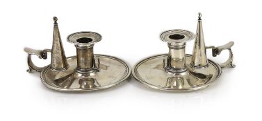 A pair of early Victorian silver circular chambersticks, by R & S Garrard & Co,with engraved crests,