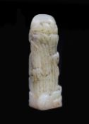 A small Chinese white and grey jade seal,carved in the form of shafts of bamboo beside a pillar of