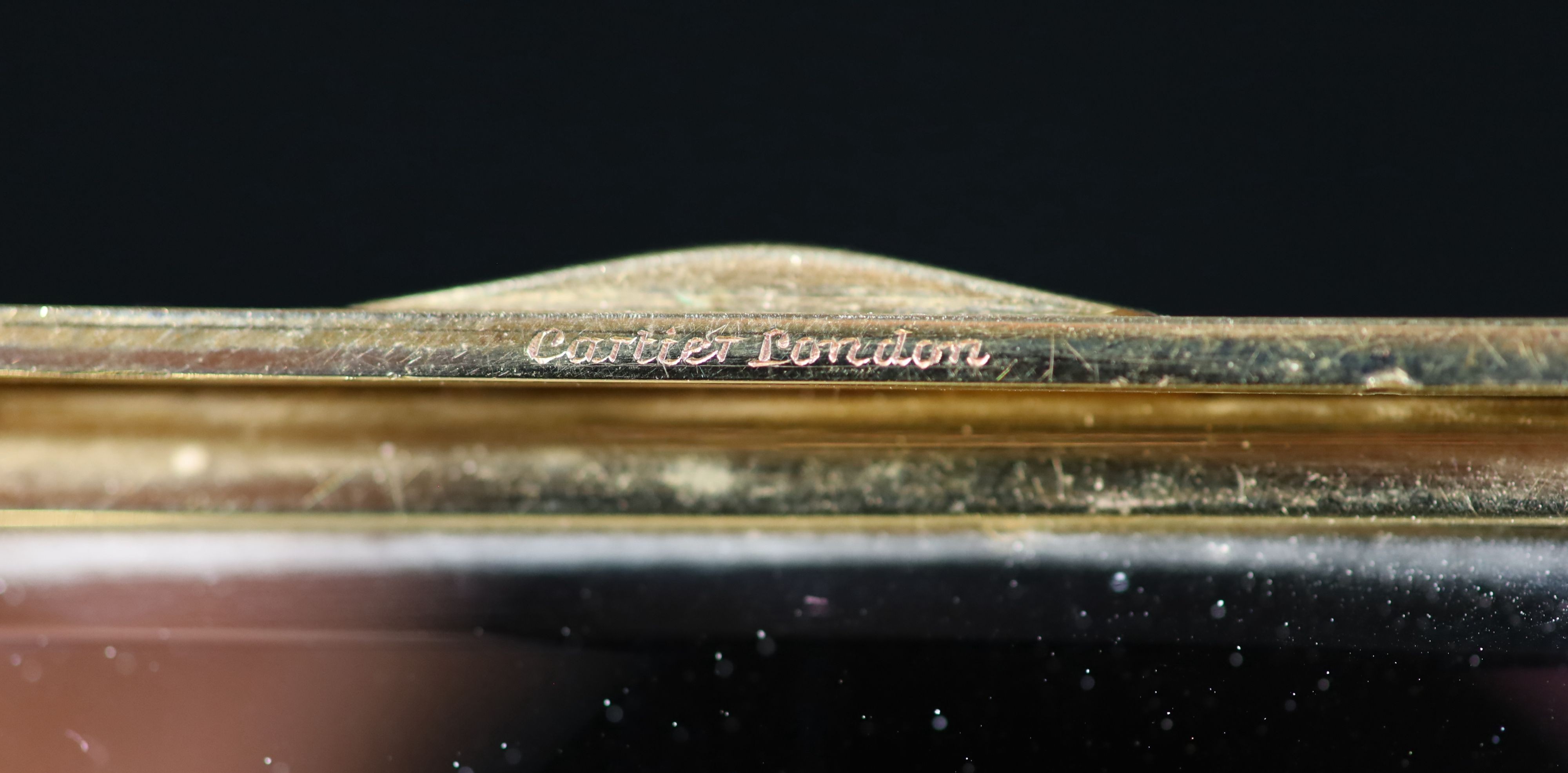 A 1930's Cartier 9ct gold compact, with diamond set thumbpiece,with reeded decoration and handled - Image 7 of 8