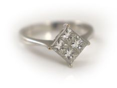 A modern 18k white gold and princess cut diamond set four stone cluster ring,size O, gross weight