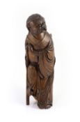 A Chinese bamboo figure of Li Tieguai, 18th/19th century,balancing upon his iron crutch, with a
