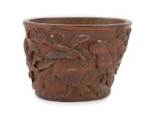 A Chinese bamboo libation cup, late Qing dynasty,carved in relief with birds amid pomegranates and