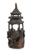 A Chinese bamboo model of a pavilion, 19th century,intricately carved with a scene of dignitaries