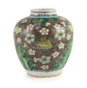 A Chinese enamelled porcelain ovoid jar, early Kangxi period,painted with ribbon-tied auspicious