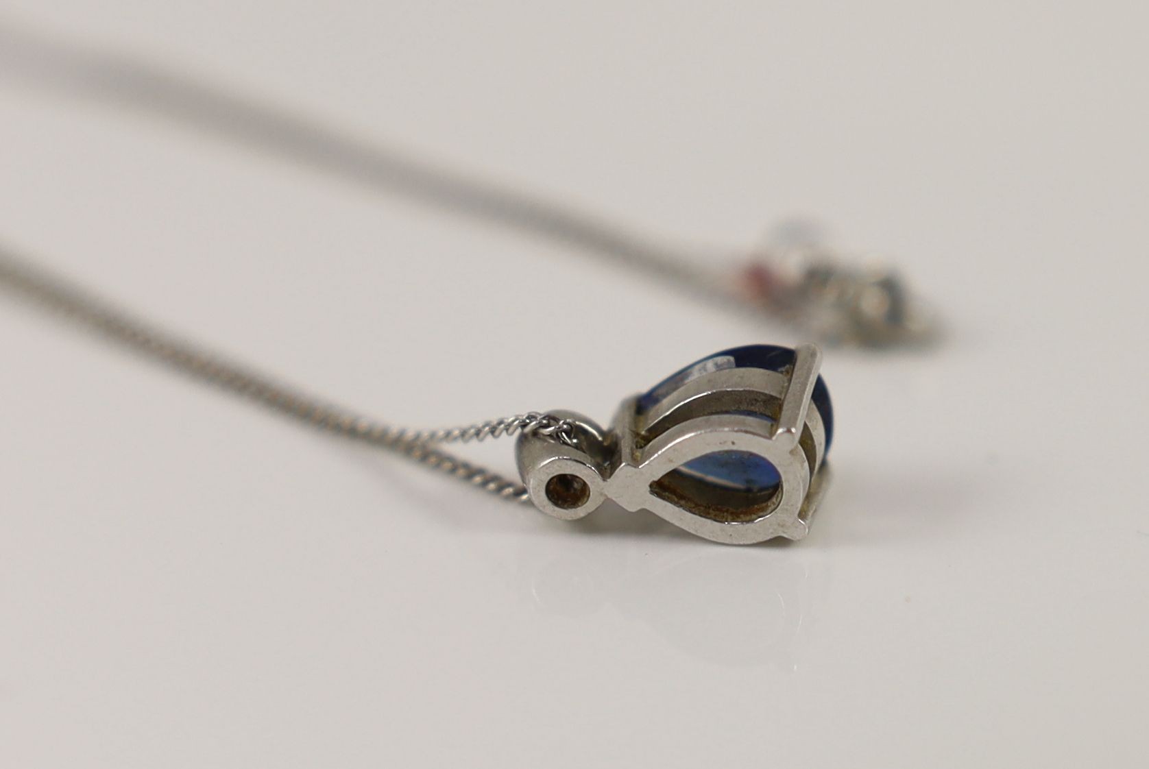 A platinum, pear shaped sapphire and single stone diamond set pendant necklace,pendant 13mm, 46cm, - Image 3 of 3