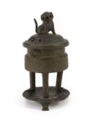 A Chinese bronze tripod censer, ding, Xuande mark, 18th/19th century, with associated cover and