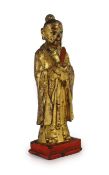 A Chinese Ming lacquered bronze figure of an official holding a tablet,on a rectangular plinth