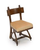 A Victorian reformed gothic oak dining chair designed by Edward Welby Pugin, c.1864,with revealed