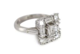 A square, baguette and round cut diamond set square cluster ring,the stones of good colour,