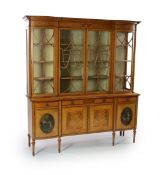 An Edwardian Sheraton revival ebony strung satinwood display cabinet,with painted frieze and four