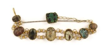 A 19th century gold and graduated seven antique stone scarab set bracelet,the bases with