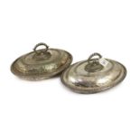 A pair of plated oval entree dishes, covers and detachable handles,with beaded borders, each