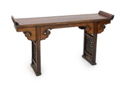 A Chinese elm and cypress wood altar table, 17th/18th Century,the panelled top with shaped ends