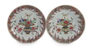 A pair of Chinese famille rose dishes, early Qianlong period,each painted with a basket of