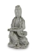 A Chinese blanc-de-chine seated figure of Guanyin, Dehua kilns, 19th/20th century,holding a ruyi