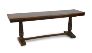 An 18th century walnut refectory table,with a single piece of timber top, on turned columns and