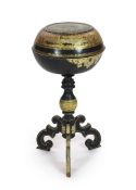 A Victorian papier mache and ebonised wood tripod work table,with gilt, green and cream decoration