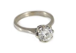 A white gold and solitaire diamond ring,the round cut stone weighing approximately 1.25ct, size N,