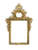A George I carved giltwood wall mirror,with scrolling crest and floral carved frame,W.71cm H.