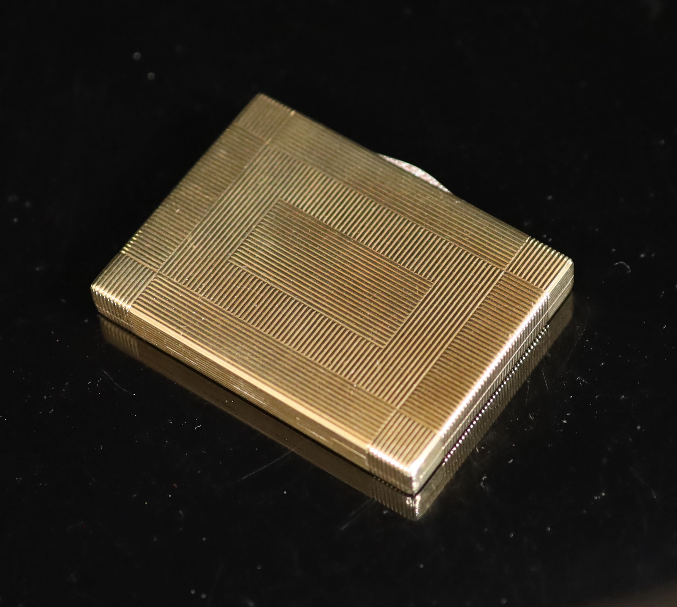 A 1930's Cartier 9ct gold compact, with diamond set thumbpiece,with reeded decoration and handled - Image 4 of 8
