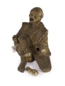 A Japanese terracotta figure of a kneeling and shouting man,formerly from Agatha Christie’s home,