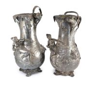 A pair of very large WMF Art Nouveau silvered pewter vases,modelled with water nymphs and children