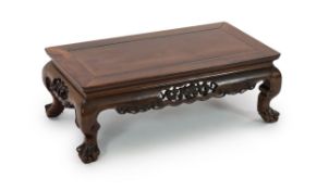 A Chinese hongmu Kang table, 19th century,the panelled rectangular top above a fruiting vine